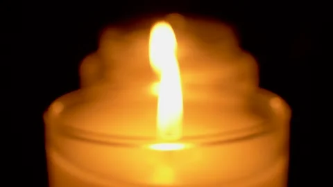 Lighting a Candle in the Night (4K) Video stock 330280408