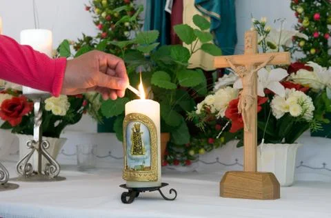 Lighting a candle Stock Photos