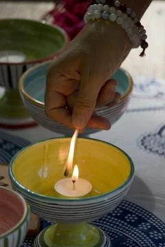 Lighting a candle 库存照片