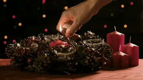 Lighting up the candles on the advent wreath Video stock 99079105