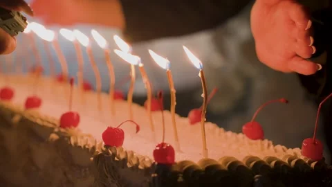 Lighting candles on the cake Stock Footage 329248992