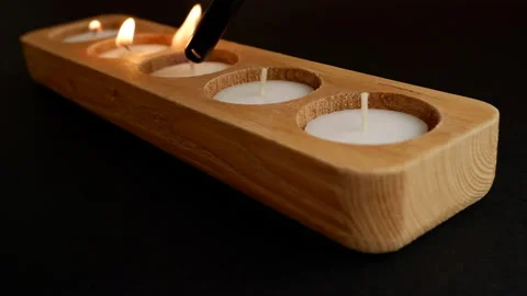 Lighting candles close up 4K black background Stock Footage 172211337