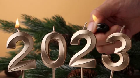 Lighting candles digits 2023 dates of the upcoming new year. Video stock 216813825