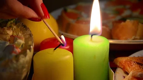 Lighting candles on a festive table 库存影片 74395276