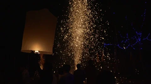 Lighting candles, lanterns in the sky at night in the Lantern Festival Stock Footage 119997431