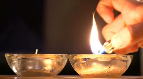 Lighting Candles with a Lighter  Stock Footage 733543