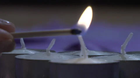 Lighting candles with a match Stock Footage 49861158