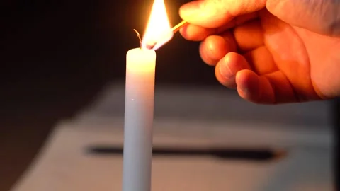 Lighting candles at night, writing, reading and learning Stock Footage 155607003