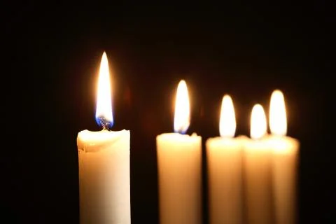Lighting candles Stock Photos
