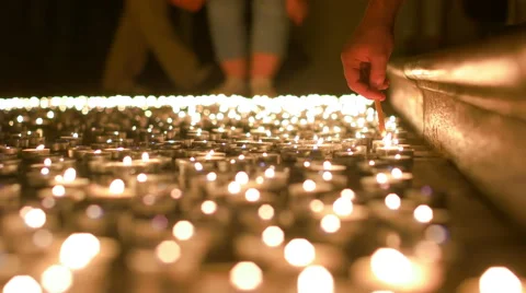 Lighting Up Candles of Prayer Stock Footage 64143405