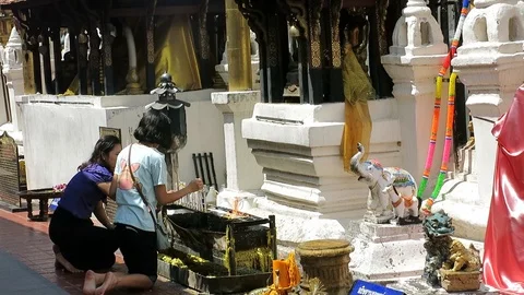 Lighting candles in the Thai temple Stock Footage 101835349
