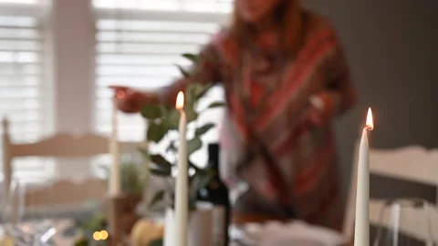 Lighting candles on Thanksgiving dinner table Stock Footage 161577099
