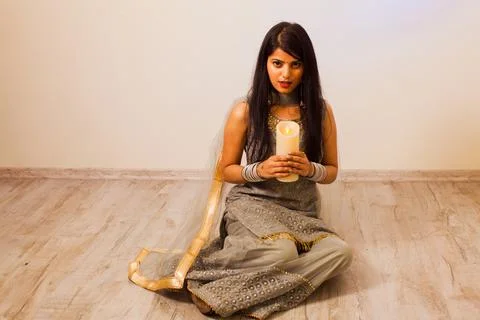 Lighting candles while Indian traditional holiday Diwali Stock Photos