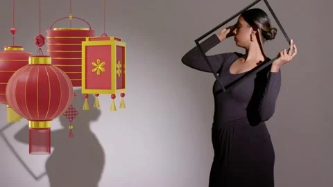 Lighting casting shadow engaging with lanterns, model stepping in holding square Stock Footage 333774332