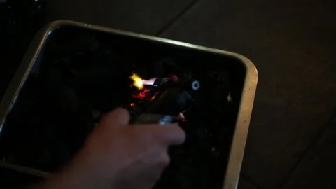 Lighting charcoal with a blowtorch Stock Footage 137945720