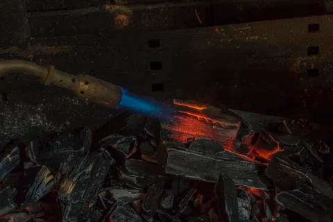 Lighting Charcoal With Propane Torch Stock Photos