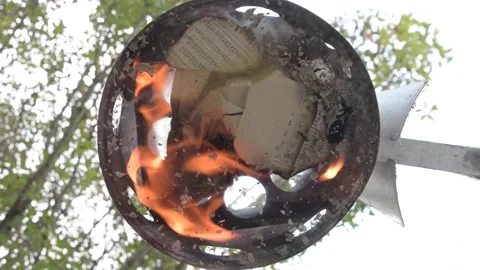 Lighting charcoal underneath a chimney Video stock 163848495