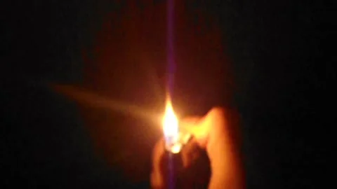 Lighting A Cigarette Lighter In A Warm Black Background Stock-Footage 155537232
