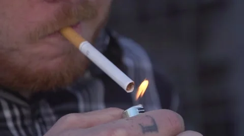 Lighting up a Cigarette in Super Slow Motion Stock Footage 54763824