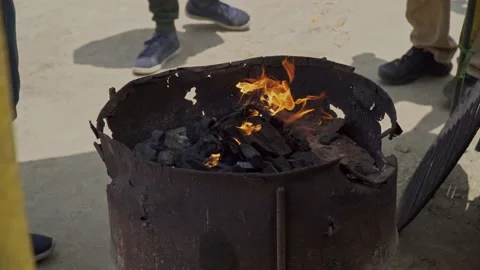 Lighting up coal fire with gasoline Stock Footage 187648495