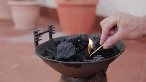 Lighting coals in a barbecue grill 動画素材 147173522