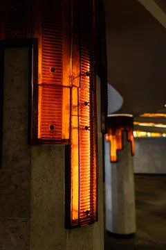 Lighting of columns in the underpass. Orange lighting. Decorative lighting Stock Photos