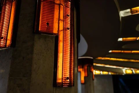 Lighting of columns in the underpass. Orange lighting. Decorative lighting Stock Photos