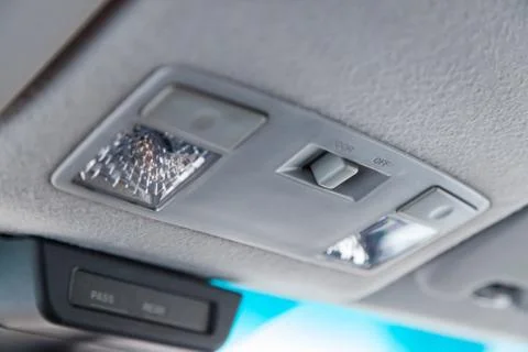 Lighting control inside the car from the top on the instrument panel behind t Stock Photos