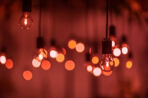 Lighting decor. Retro light bulb filament close up.Illuminated. Stock Photos