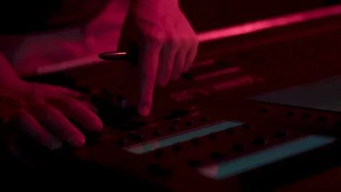 Lighting designer using lighting board Stock Footage 91714889