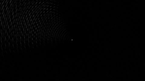 Lighting effect in a dark tunnel with swirling patterns in Stock Footage 339514887