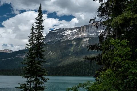 Lighting effect on the mountain over the Emerald lake Stock Photos
