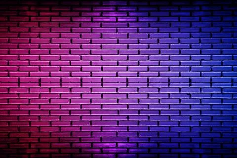 Lighting effect neon light on brick wall texture for background. Stock Photos