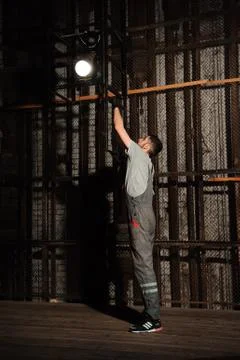 The lighting engineer adjusts the lights on stage Stock Photos