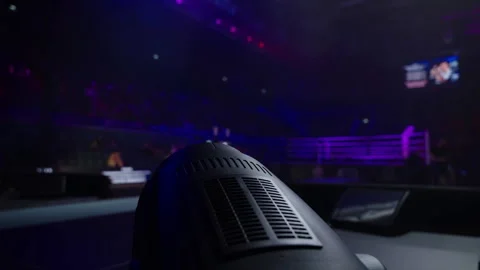 Lighting equipment against the background of a large hall and a boxing ring. Stock Footage 255424034