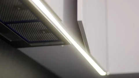 Lighting features and modern design elements in a stylish kitchen renovation Stock Footage 310086571