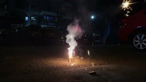 Lighting up a fire cracker called Flower Pot Stock-Footage 143666456