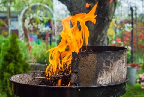 Lighting fire during spring barbecue garden Stock Photos