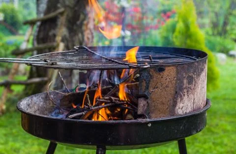 Lighting fire during spring barbecue garden 스톡 사진
