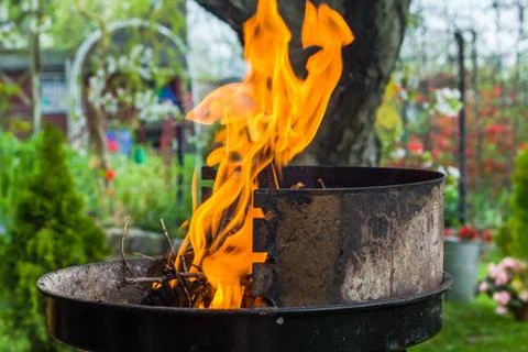 Lighting fire during spring barbecue garden Foto stock