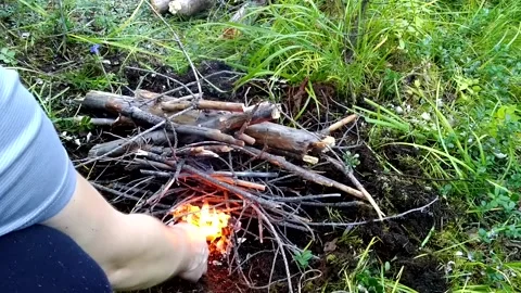 Lighting a fire in the forest Stock Footage 160807205