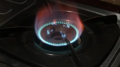 Lighting a fire on a gas stove Stock Footage 324941970