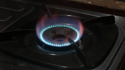 Lighting a fire on a gas stove Stock Footage 324941981