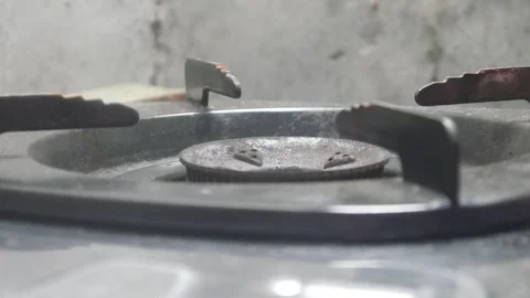 Lighting a fire on a gas stove Stock Footage 324941994