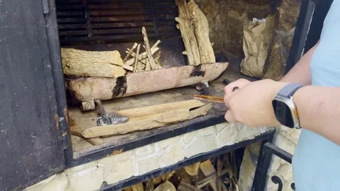 Lighting Fire in Outdoor Grill, Preparing Campfire for Riverside Picnic Stock Footage 334133915