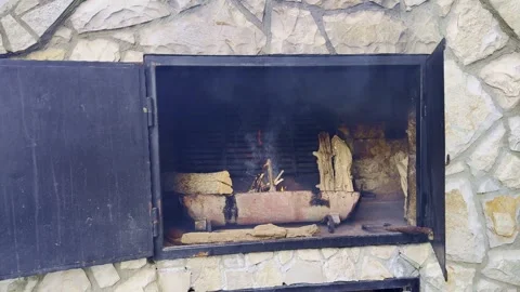 Lighting Fire in Rustic Outdoor Oven, Preparing Wood for Cooking Stock Footage 334133723