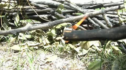 Lighting Fire with Stick in Sunlight 스톡 동영상 12592993