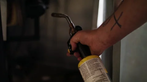 Lighting a furnace Stock Footage 138405596