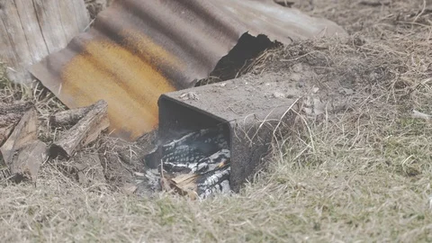Lighting a home smokehouse Stock Footage 104734925
