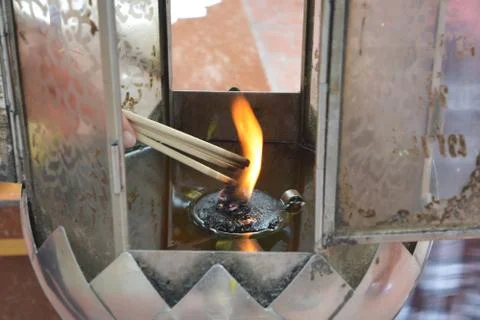 Lighting incense to Buddha Stock Photos